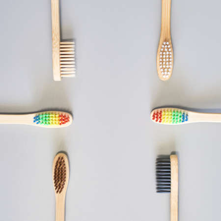 Ecology toothbrush on grey background. Different color. Diversity concept. Sustainable mouth product. Zero waste lifestyle. Organic accessory group. Dental health at home. Biodegradable recycleの写真素材