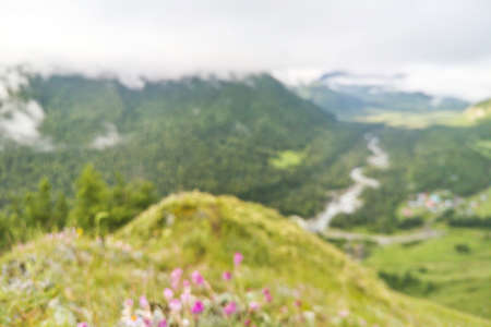 Blur mountain background. Green color. Fantastic view. Near forest. Rain day. Mountain hills. Countryside trekking. Vacation landscape. Russian Altai mountains. Multa region. Staycation conceptの写真素材