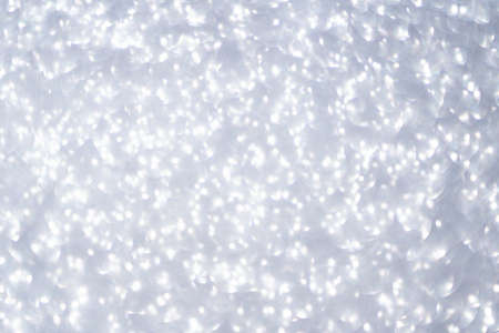 Bokeh circle with silver sparkles background. Grey glitter backdrop. Monochrome texture. New year luxury snow. Copyspace. Shimmer confetti wallpaper. Dreamy shiny design detailの写真素材