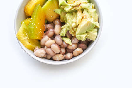 Eating healthy food. Organic calcium salad with vegetables and oil. Round plate. Home dinner or lunch. Vitamin cereal. Bowl at tableの写真素材