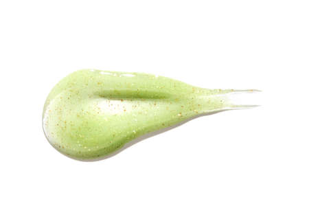 Face scrub texture. Cream skincare cosmetic. Organic stroke. Feet oily cleanser smudge. Particles in gel. White background. Top view.の写真素材