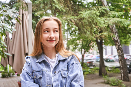 Pretty girl outdoors. Caucasian real people portrait. Single female person. Staycation ecology concept. Positive attractive human. Happy emotionsの写真素材