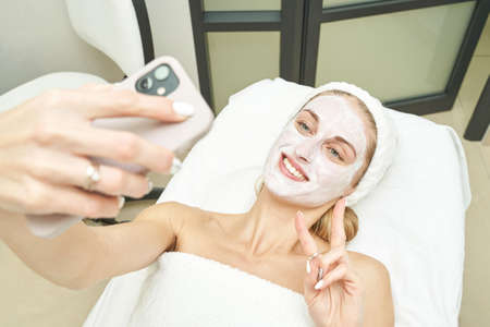 Portrait of moisturizing clay mask for medical design. Woman skin procedure. Natural cosmetic...