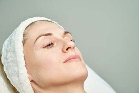 Injection at spa salon. Doctor paint on skin. Closeup. Pretty female patient. Beauty treatment. Healthy procedure. Young women face. Plasmolifting rejuvenationの写真素材