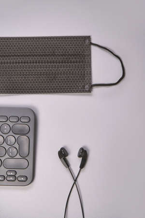 Podcast concept. Black microphone recorder, content notebook keypad with black earphones. Close up....