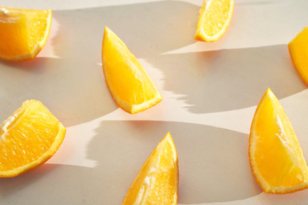 Summer coral orange slice. Citrus food diet. Fruit round juicy concept. Modern sweet cut photography. Bright color. Sunny piece creative design. Tropical vegetables. Summer vibe patternの写真素材