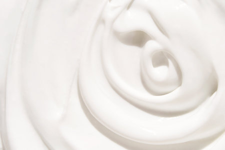 Cosmetic swirl product background. White toothpaste texture. Cleansing face emultion. Milk liquid sunscreen. Closeup hydrating cream. Abstract makeup lotion swatch. Beauty spa foamの写真素材
