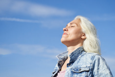 Pure skin care mature beauty portrait. Profile side view. Anti wrinkle senior cream. Female head....