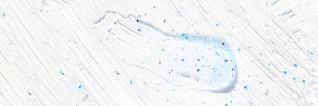 Face scrub texture. Cream skincare cosmetic. Organic stroke. Feet oily cleanser smudge. Particles in gel. White background. Top view. Fluid treatmentの写真素材