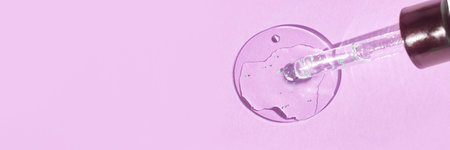 Skincare concept with serum dropper and liquid on light pink background for beauty and wellness...