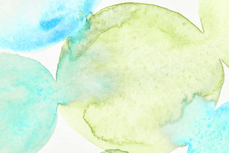 Vibrant watercolor abstract background with soft blue and green tones.の写真素材