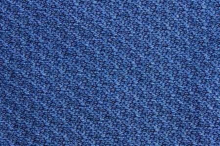 Close up of textured blue fabric with detailed weave pattern for background or design inspiration.