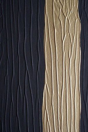 Textured abstract painting with black and gold vertical lines and grooves.の写真素材