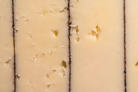 Cheese with truffles. Macro closeup. Delicious expensive cheese. High quality photoの写真素材