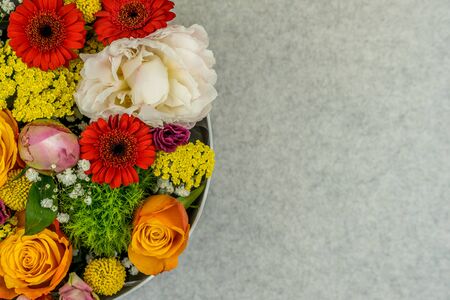 Flower bouquet of different colorful on the natural grey background. Spring style. Romantic wedding background. Floral design.の写真素材