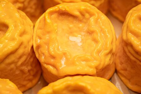 Soft cheese Langres, French cow milk. Creamy and crumbly orange colored, French cheeses collection. High quality photoの写真素材