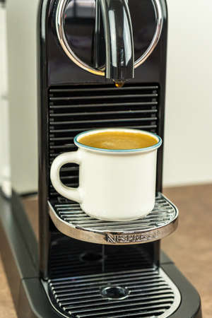 Bayonne, France. 23.06.2020. Coffee Espresso preparing from Nespresso Coffee Machine. Closeup, technology background.のeditorial素材