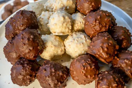 Black, white and milk chocolate on the white background. Macro close of french chocolate. Fresh organic nut.の写真素材