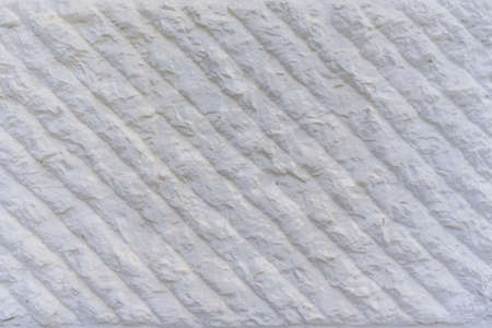 White cover textured designed wall. Surface design. Background texture wall. Geometric background.の写真素材