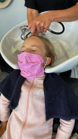 Young woman walking on the Atlantic ocean beach. Beautiful model. Soft background. High quality photoの写真素材