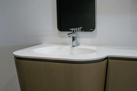 White top ceramic washbasin with glossy metal mixer. High quality photoの写真素材