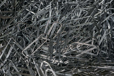 Metal paper clips in a heap, macro close-up. High quality photoの写真素材