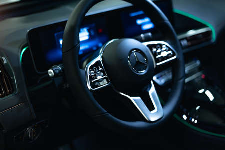 Monte-Carlo, Monaco 10.09.2020 Exhibition EVER E-Mobility. Interior view of car steering with black salon. Modern luxury car interior. Blurred focus background.のeditorial素材