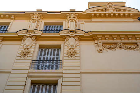 Old French house with traditional balconies and windows. Beaulieu-sur-Mer, France.の写真素材