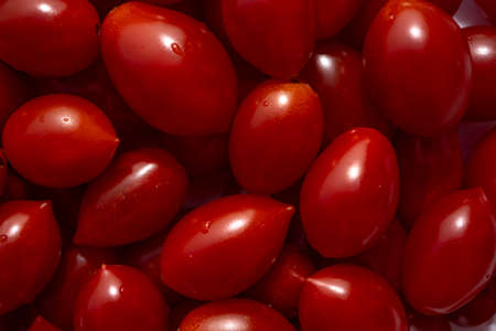 Texture of delicious red tomatoes in basket at the summer market place. Organic vegetables, It can...