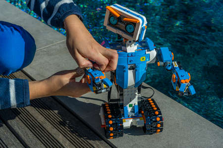 Nice, France. 16 October, 2020. Robotics. The Lego Boost robot car. A boy playing with robot. Science, technology, engineering, mathematics. Outdoor backgroundのeditorial素材