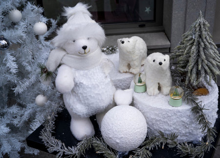Cute teddy bear and polar bears on the background of the Christmas tree. Outdoor winter decorations. High quality photoの写真素材