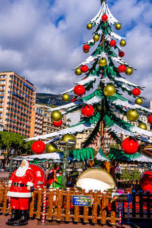 Monte Carlo, Monaco - 14 December, 2020 People ice skating in the Christmas market. Traditional market every winter in the Port in the city center. Hight quality photoのeditorial素材