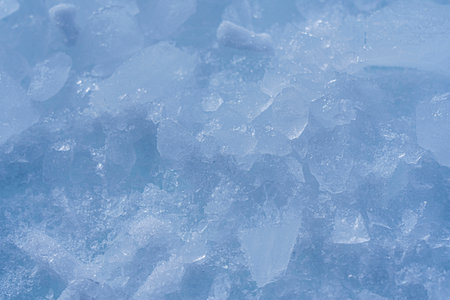 Ice and snow macro texture close-up. Outdoor view of ice blocks and snow in winter. Hight quality photo.の写真素材