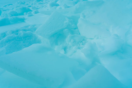 Beautiful abstract natural winter background. Pure aquamarine mountain snow. High quality photo