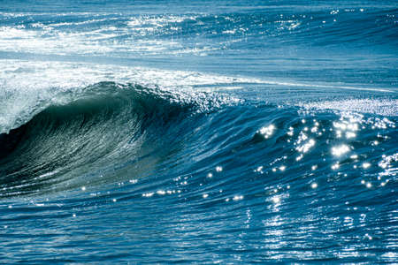 Colorful splash of waves close-up in the mediterranean sea.