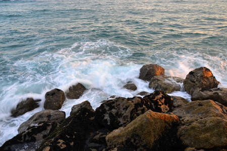 Colorful splash of waves close-up in the mediterranean sea.
