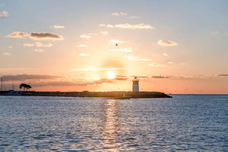 Morning view of the lighthouse and yacht port. Mediterranean sea of french riviera during sunrise. High quality photoの写真素材