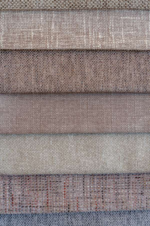 Collection of fabric in pastel brown shades. Fabric sample. Multicolor Fabric texture background....