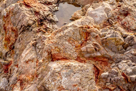 Stones texture nature photo with lake. Rock background. Mountain close-up. Mountain texture. High...