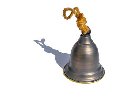 Old vintage brass metal bell isolated on a white background. High quality photo