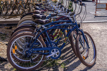 Capbreton, FRANCE - 06/27/2020: The bicycles for rent parking at the bicycle stand.