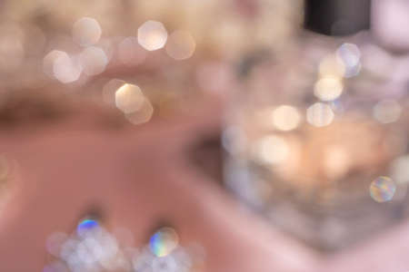 Blurred Background. Luxe perfume in beautiful bottle with accessory on toilet table. Luxury beauty brand concept.の写真素材
