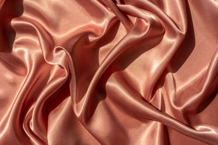 Abstract luxury beige silk, Satin fabric texture, soft blur background, elegant wallpaper design. High quality photoの写真素材