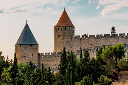 Carcassonne, France - 02.07.2021: The Ancient Fortress of Carcassonne in the light of the setting...