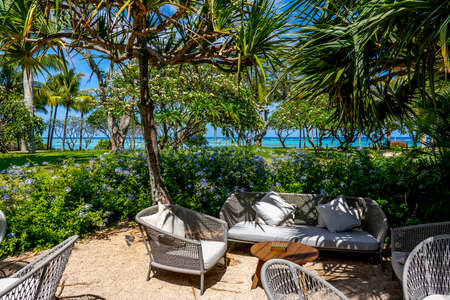 Mauritius Island - 10.31.2021: Canonnier Beachcomber Hotel, chairs on the sand outdoor lounge. Tropical paradise island holidays on the hotel. High quality photoのeditorial素材