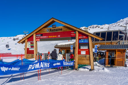 Alpe DHuez, FRANCE - 01.01.2022: Famous ski resort in French Alps, France, Europe. Skiers skiing on the mountain, ski lift, family sports weekend, holidays in the snow mountains concept. Winter timesのeditorial素材