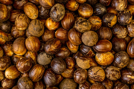 Fresh mace and nutmeg background with selective focus. High quality photo