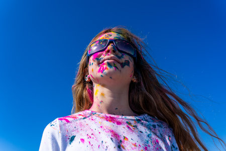 Young european girl celebrating holy festival on a blue sky background. High quality photoの写真素材