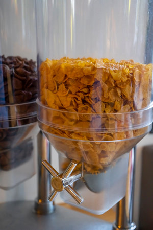 Cereal and cornflakes dispensers on a self service breakfast in a hotel. High quality photo