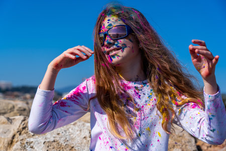 Young european girl celebrating holy festival on a blue sky background. High quality photoの写真素材